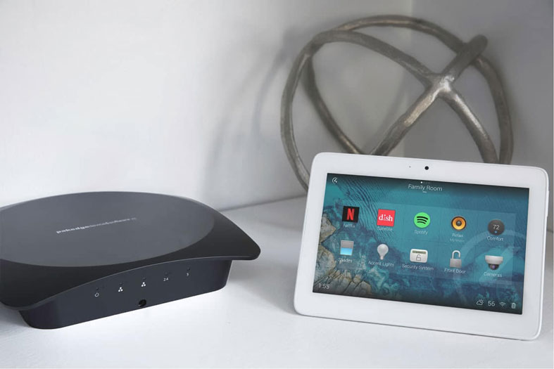 White Tablet on Table with Router and Metal Decoration
